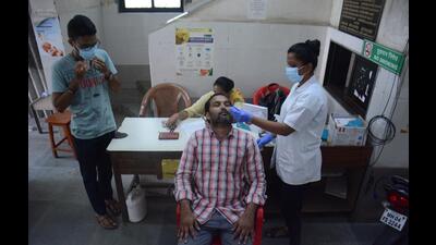 A person is being tested for Covid in Thane. The active Covid cases rise from 35 on April 30 to 290 on May 31 in Thane Municipal Corporation limits. (PRAFUL GANGURDE/HT PHOTO) A person is being tested for Covid in Thane. The active Covid cases rise from 35 on April 30 to 290 on May 31 in Thane Municipal Corporation limits. (PRAFUL GANGURDE/HT PHOTO)