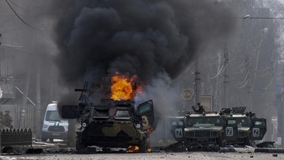 A Russian armored personnel carrier burns amid damaged and abandoned light utility vehicles after fighting in Kharkiv, Ukraine, Feb. 27, 2022. (AP Photo/Marienko Andrew) A Russian armored personnel carrier burns amid damaged and abandoned light utility vehicles after fighting in Kharkiv, Ukraine, Feb. 27, 2022. (AP Photo/Marienko Andrew)