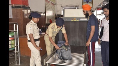 Railway police checking luggage at the Ludhiana railway station on Thursday. The sole baggage scanner is currently non-operational. (Harvinder SIngh/HT)