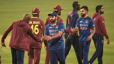 India's Virat Kohli (2R) and India's captain Rohit Sharma (3L) shake hands with West Indies' players (AFP)
