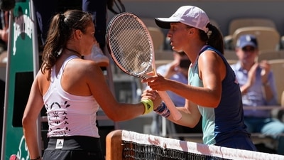 Poland's Iga Swiatek, right, is congratulated by Russia's Daria Kasatkina&nbsp; (AP)