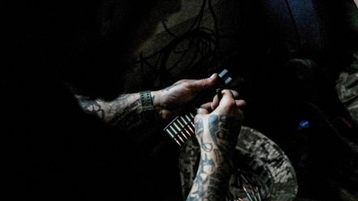 A Ukrainian service member loads ammunition into cartridges at his new position retaken by the Ukrainian forces, amid Russia's attack on Ukraine, in Donetsk region,&nbsp; (REUTERS)