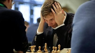 Sergey Karjakin of Russia looks at a board during a game (REUTERS)