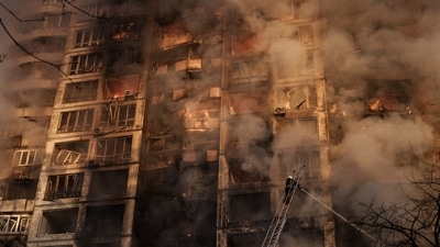 Ukrainian firefighters work at a bombed apartment building in Kyiv, Ukraine, Tuesday, March 15, 2022. (AP Photo/Felipe Dana) (AP) Ukrainian firefighters work at a bombed apartment building in Kyiv, Ukraine, Tuesday, March 15, 2022. (AP Photo/Felipe Dana) (AP)