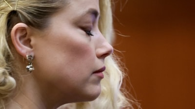 Actor Amber Heard waits before the verdict was read at the Fairfax County Circuit Courthouse in Fairfax. (AP) Actor Amber Heard waits before the verdict was read at the Fairfax County Circuit Courthouse in Fairfax. (AP)