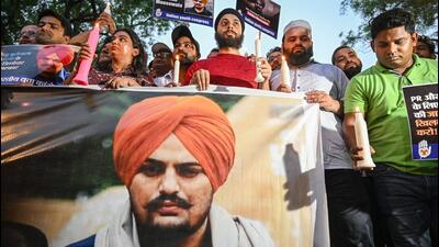 Activists take out a candle light march in the memory of Punjabi singer and Congress leader Sidhu Moose Wala. (PTI) Activists take out a candle light march in the memory of Punjabi singer and Congress leader Sidhu Moose Wala. (PTI)