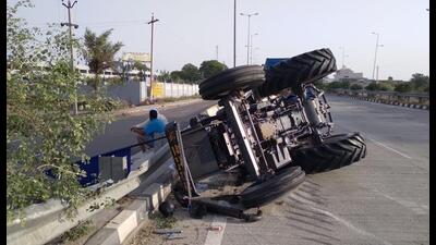 The tractor-trailer that overturned after being hit by a truck on the Amritsar-Bathinda national highway near Tarn Taran on Thursday. (HT Photo)