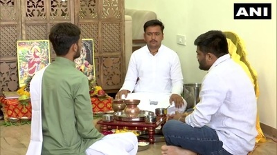 Hardik Patel performs puja at home before joining the BJP on June 2 (Credit: ANI) (ANI) Hardik Patel performs puja at home before joining the BJP on June 2 (Credit: ANI) (ANI)