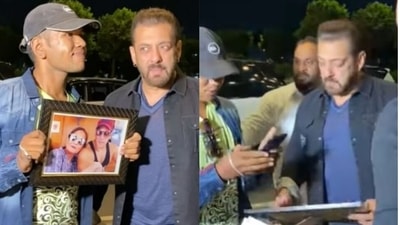 Salman Khan with a fan at the Mumbai airport. Salman Khan with a fan at the Mumbai airport.