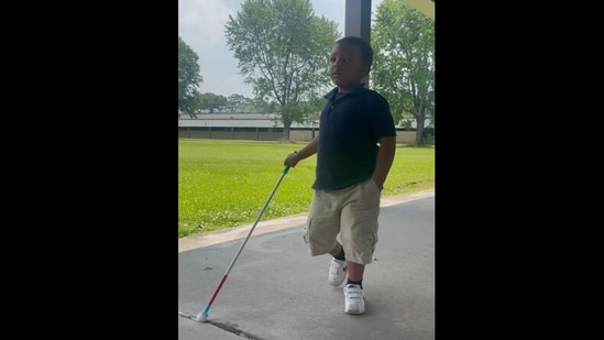 The visually impaired boy walking at school before getting surprised by his dad.&nbsp;(Instagram/@rosspirelli)