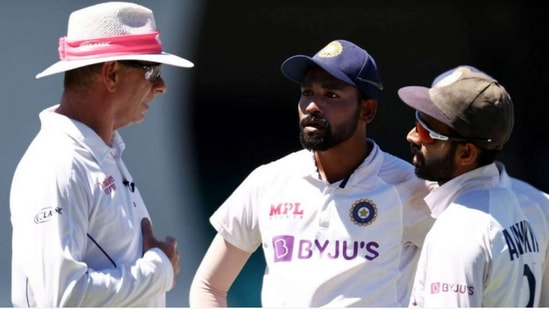 Ajinkya Rahane and Mohammed Siraj talking to umpire Paul Reiffel in Sydney Test