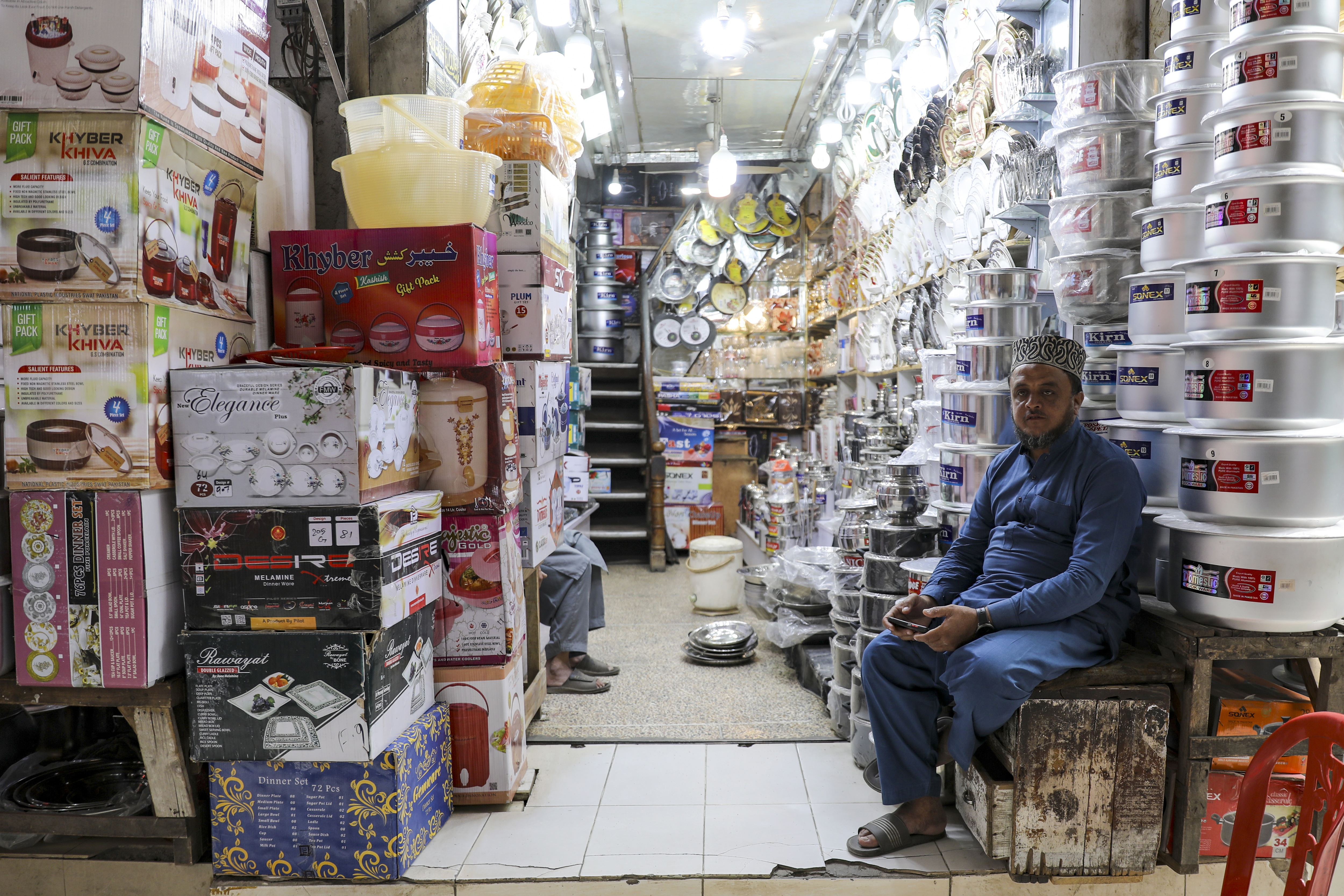 Shop keepers wait for the costumers in Rawalpindi, Pakistan on Monday. (Bloomberg)