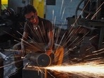 Despite an improvement in new orders including exports, and rise in manufacturing jobs “business sentiment was dampened by inflation concerns in May, S&P Global said in a release. (AP file photo. Representative image) Despite an improvement in new orders including exports, and rise in manufacturing jobs “business sentiment was dampened by inflation concerns in May, S&P Global said in a release. (AP file photo. Representative image)