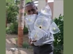 The image is taken from the video shared by Anand Mahindra that demonstrates how a DIY fruit plucking tool can be made from scrap. (Twitter/@anandmahindra) The image is taken from the video shared by Anand Mahindra that demonstrates how a DIY fruit plucking tool can be made from scrap. (Twitter/@anandmahindra)