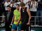 Rafael Nadal walks alongside Germany's Alexander Zverev who retired with an ankle injury in the semifinal match(AP) Rafael Nadal walks alongside Germany's Alexander Zverev who retired with an ankle injury in the semifinal match(AP)