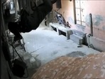 Thief scrambles across walls to rob house, his 'Spider-Man' moves caught on camera.