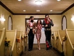 Elvis impersonator walks down the aisle during a wedding ceremony at the Graceland Wedding Chapel in Las Vegas.&nbsp;