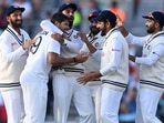 Indian players celebrate the wicket of Joe Root