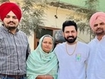 An old picture of Gippy Grewal with Sidhu Moose Wala and his parents at Sidhu's village.