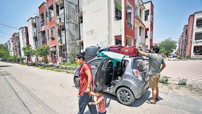 A Hindu family arrives from Kashmir at a migrant camp on the outskirts of Jammu on Friday. (AP) A Hindu family arrives from Kashmir at a migrant camp on the outskirts of Jammu on Friday. (AP)