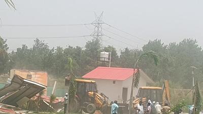 JCB machines raze a farmhouse built on the Yamuna floodplains in Noida. (Sourced)