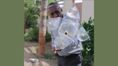 The image is taken from the video shared by Anand Mahindra that demonstrates how a DIY fruit plucking tool can be made from scrap.&nbsp; (Twitter/@anandmahindra)