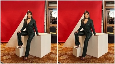 In classic black stilettos, Raveena wore her tresses open in straight locks as she posed for the cameras. (Instagram/@officialraveenatandon)