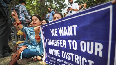 Jammu-based government employees, posted in Kashmir, stage a protest demonstration for their transfer to their home districts. (PTI) Jammu-based government employees, posted in Kashmir, stage a protest demonstration for their transfer to their home districts. (PTI)