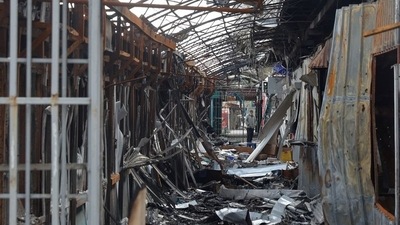 A local resident stands next to debris of an open market destroyed by a military strike, as Russia's attack on Ukraine continues, in Sievierodonetsk. (REUTERS)