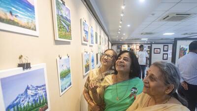 Retired teachers (from L) Geeta Chitnis, Shailaja Pathak and Chanda Kolhatkar at the exhibition of their paintings at Yashwantrao Chavan art gallery, in Pune on Friday. (PRATHAM GOKHALE/HT)