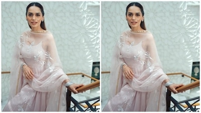In the end, Manushi chose silver bangles, embellished juttis, dainty silver earrings, a bindi, glossy blush pink lip shade, sleek eyeliner, mascara on the lashes, subtle eye shadow, glowing skin, blushed cheeks and beaming highlighter to round it all off. A centre-parted half-tied hairdo completed the look. (Instagram) In the end, Manushi chose silver bangles, embellished juttis, dainty silver earrings, a bindi, glossy blush pink lip shade, sleek eyeliner, mascara on the lashes, subtle eye shadow, glowing skin, blushed cheeks and beaming highlighter to round it all off. A centre-parted half-tied hairdo completed the look. (Instagram)