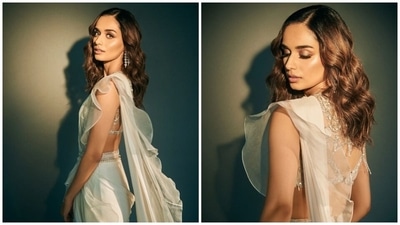 Earlier, Manushi had dropped pictures of another promotional look for Samrat Prithviraj. The 25-year-old star donned an ivory ruffled saree, teamed with a sleeveless embellished blouse. She paired the traditional look with a kamar bandh, minimal accessories and glowing glam picks. (Instagram) Earlier, Manushi had dropped pictures of another promotional look for Samrat Prithviraj. The 25-year-old star donned an ivory ruffled saree, teamed with a sleeveless embellished blouse. She paired the traditional look with a kamar bandh, minimal accessories and glowing glam picks. (Instagram)