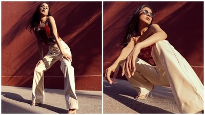 Meanwhile, Shehnaaz Gill often posts pictures of her glamorous looks on Instagram. Recently, she delighted her fans by dropping a stunning set of photos that showed her in a faux leather strapless corset top with white flared pants. While the top comes in a brick red shade, the pants are in an off-white hue. She nailed the retro look with full sass and style. (Instagram) Meanwhile, Shehnaaz Gill often posts pictures of her glamorous looks on Instagram. Recently, she delighted her fans by dropping a stunning set of photos that showed her in a faux leather strapless corset top with white flared pants. While the top comes in a brick red shade, the pants are in an off-white hue. She nailed the retro look with full sass and style. (Instagram)