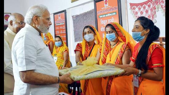 Prime Minister Narendra Modi visits the Milan Kendra, at Paraunkh in Kanpur. President Ram Nath Kovind is also seen. (PTI Photo)