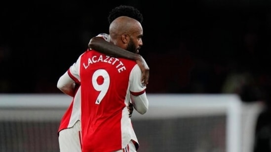 Alexandre Lacazette, front is hugged by Arsenal's Thomas Partey&nbsp;(AP)
