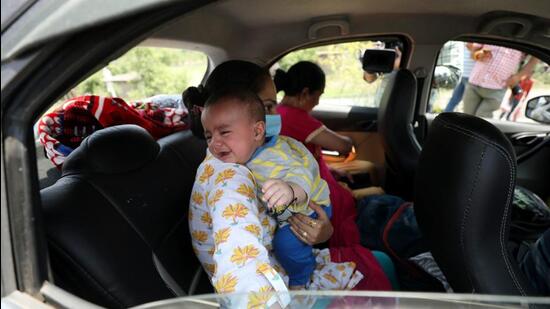 A Kashmiri Pandit family returns to Jagti migrants camp, amid the recent targeted killings in the Valley, in Jammu on Friday. (ANI)