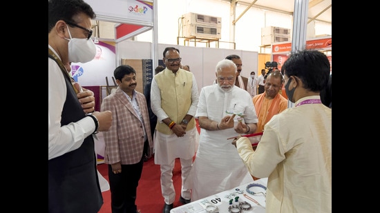 Prime Minister Narendra Modi stands with Chief Minister Yogi Adityanath, and other leaders during the Ground Breaking Ceremony @3.0 of the UP Investors Summit Lucknow Friday. (AP)