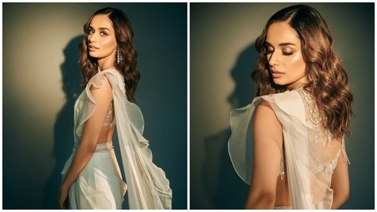 Earlier, Manushi had dropped pictures of another promotional look for Samrat Prithviraj. The 25-year-old star donned an ivory ruffled saree, teamed with a sleeveless embellished blouse. She paired the traditional look with a kamar bandh, minimal accessories and glowing glam picks.(Instagram)