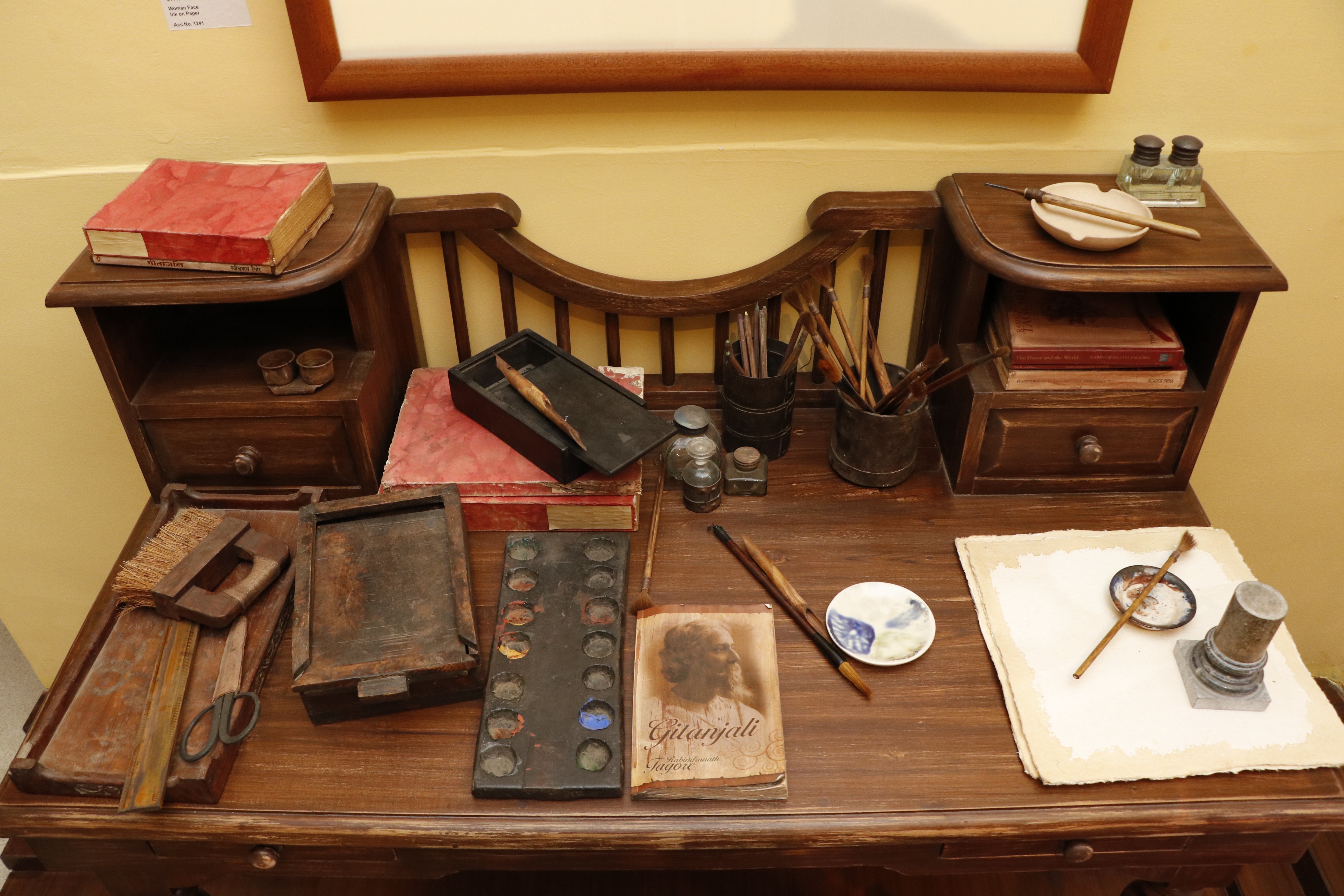 A replica of Rabindranath Tagore’s writing table with a copy of Gitanjali, a collection of his poems, and paint brushes drawing attention to his overall personality. (Photo: Dhruv Sethi/HT)