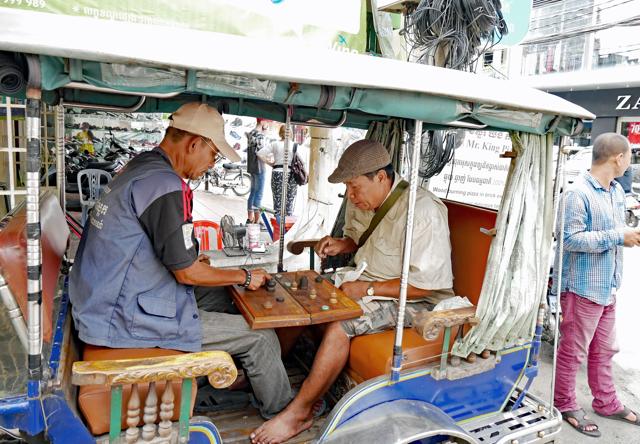 Men in Phnom Penh, Cambodia, playing Cambodian chess or ouk-khmer, a game similar to makruk, Thai chess. (Shutterstock) Men in Phnom Penh, Cambodia, playing Cambodian chess or ouk-khmer, a game similar to makruk, Thai chess. (Shutterstock)