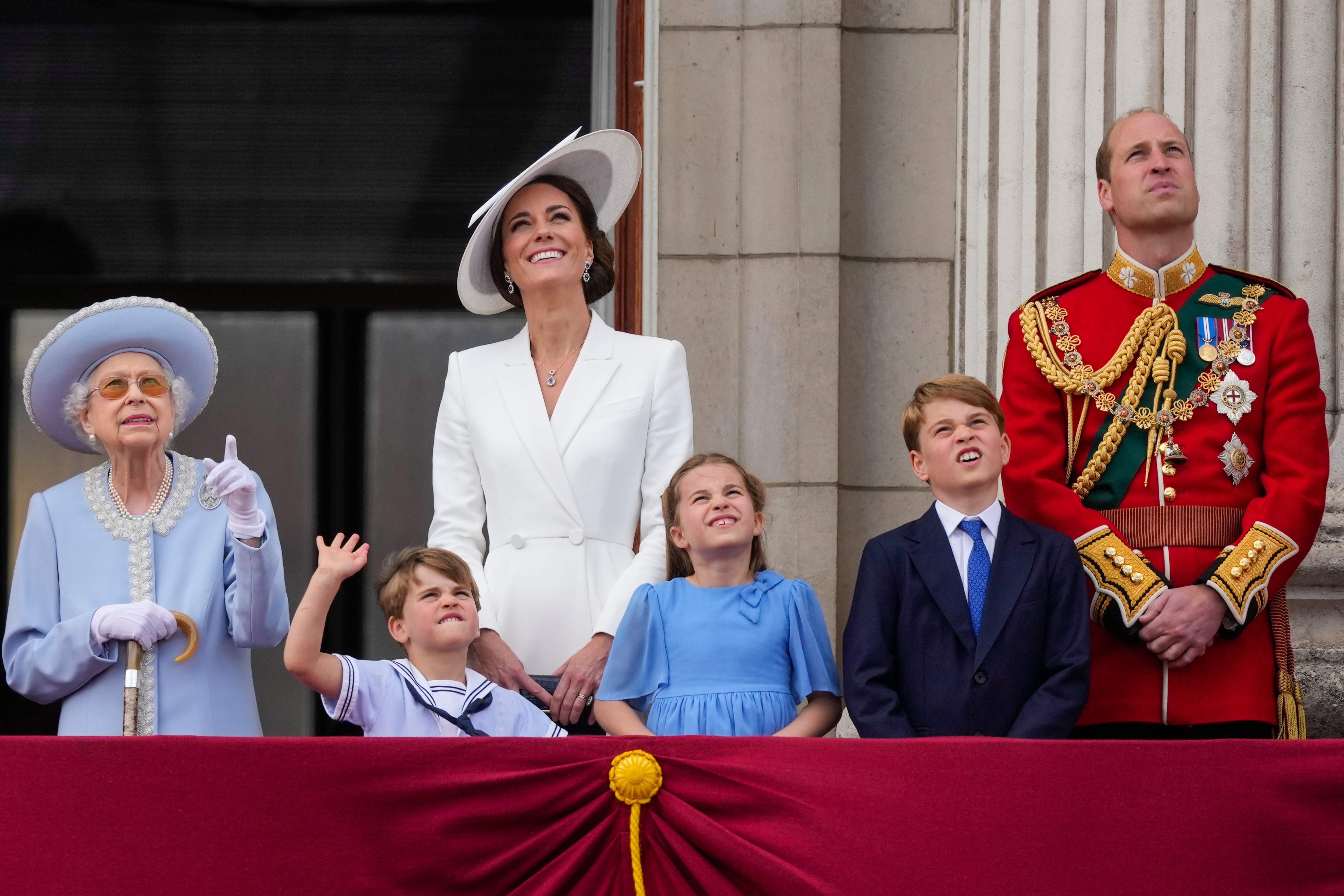 Queen Elizabeth II, from left, Prince Louis, Kate, Duchess of Cambridge, Princess Charlotte, Prince George and Prince William stand on the balcony of Buckingham Palace, London, Thursday June 2, 2022, on the first of four days of celebrations to mark the Platinum Jubilee.&nbsp;(AP)