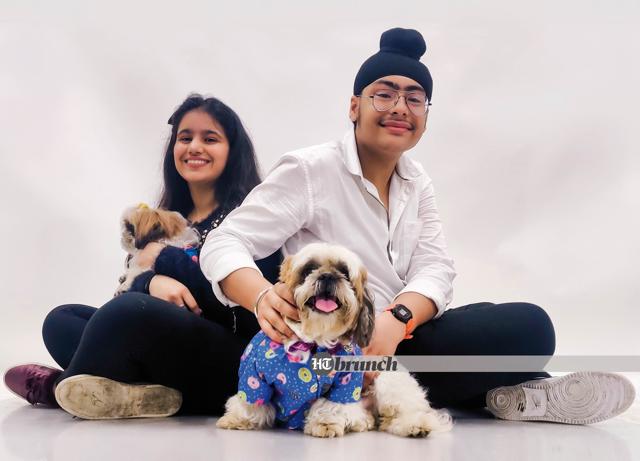 Coco and Gucci with Suhani and Aditya Veer Singh; On Suhani: Sweater by H&M; Jeans by Uniqlo; On Aditya Veer Singh: Shirt by Marks & Spencer; Jeans by Levis; On Coco & Gucci, the Shitzus: Printed shirts by Mutt Of Course (Ayushman Mitra)