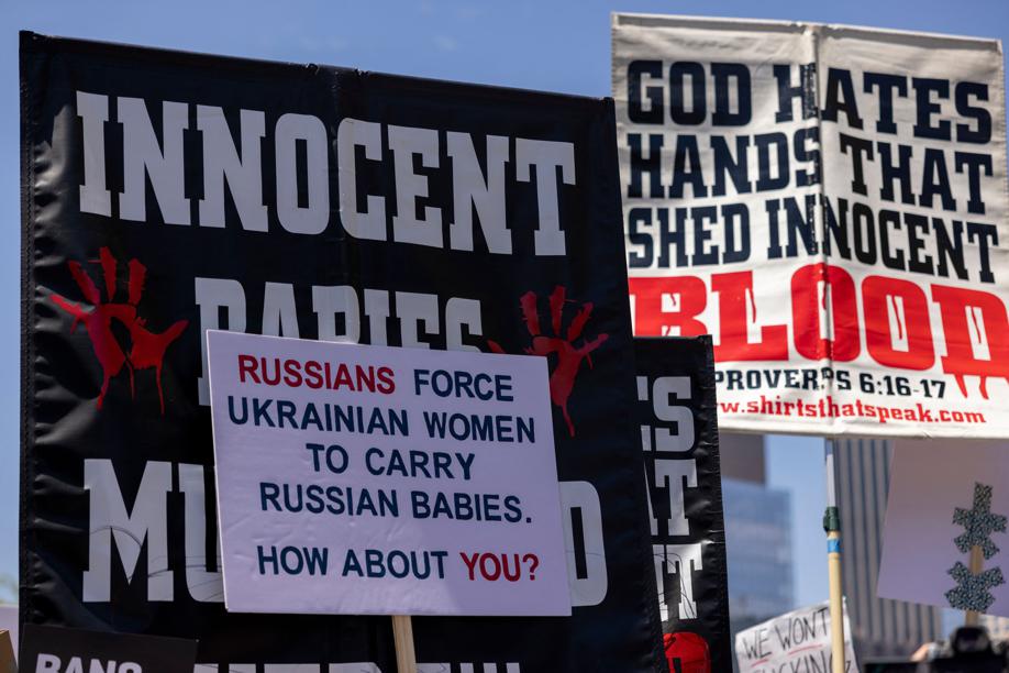 Los Angeles: Signage pertaining to alleged impregnation through rape by Russia forces in Ukraine without abortion as a choice is held near anti-abortion activists' signs during one of the Bans Off Our Bodies abortion rights protests being held across the nation today, near City Hall on May 14, 2022. (AFP photo) Los Angeles: Signage pertaining to alleged impregnation through rape by Russia forces in Ukraine without abortion as a choice is held near anti-abortion activists' signs during one of the Bans Off Our Bodies abortion rights protests being held across the nation today, near City Hall on May 14, 2022. (AFP photo)