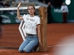 French Open - Roland Garros: Protestor ties herself to the net during the semi final between Norway's Casper Ruud and Croatia's Marin Cilic