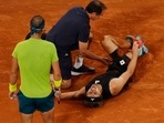 French Open - Roland Garros: Germany's Alexander Zverev receives medical attention after sustaining an injury as Spain's Rafael Nadal looks on