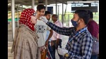 A health care worker collects a swab sample from a passenger for Covid-19 testing, Prayagraj, May 10, 2022 (PTI) A health care worker collects a swab sample from a passenger for Covid-19 testing, Prayagraj, May 10, 2022 (PTI)