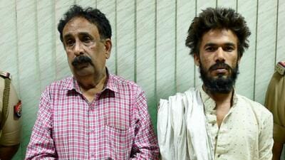 The two suspects, in police custody in Noida on Saturday. (Sunil Ghosh/ HT)