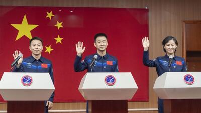 Astronauts Cai Xuzhe (left), Chen Dong (centre) and Liu Yang wave as they attend a press conference for the upcoming Shenzhou-14 mission at the Jiuquan Satellite Launch Center in northwestern China on Saturday. (AP) Astronauts Cai Xuzhe (left), Chen Dong (centre) and Liu Yang wave as they attend a press conference for the upcoming Shenzhou-14 mission at the Jiuquan Satellite Launch Center in northwestern China on Saturday. (AP)