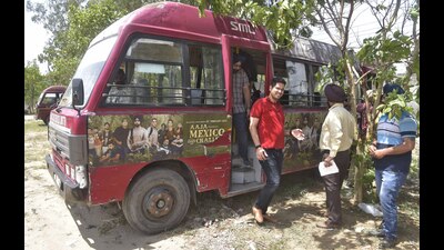 MC additional commissioner Aaditya Dachalwal inspecting city buses in Ludhiana on Saturday. (Gurpreet Singh/HT)