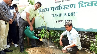 Managing director of Dedicated Freight Corridor Corporation of India RK Jain conducts a tree plantation drive on the eve of World Environment Day, at its headquarters, in New Delhi. 